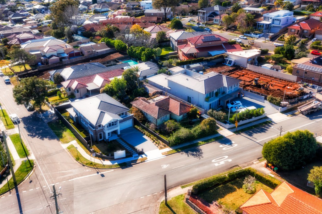 Aerial view of Sydney suburban streets with new duplex homes